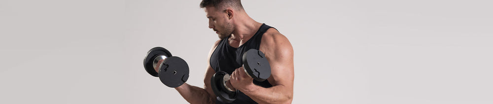 A male fitness performing dumbbell curls with AD85 adjustable dumbbells.
